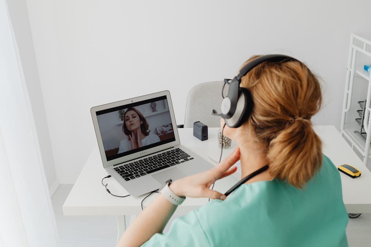 Patient Having an Online Appointment with a Doctor Using Laptop